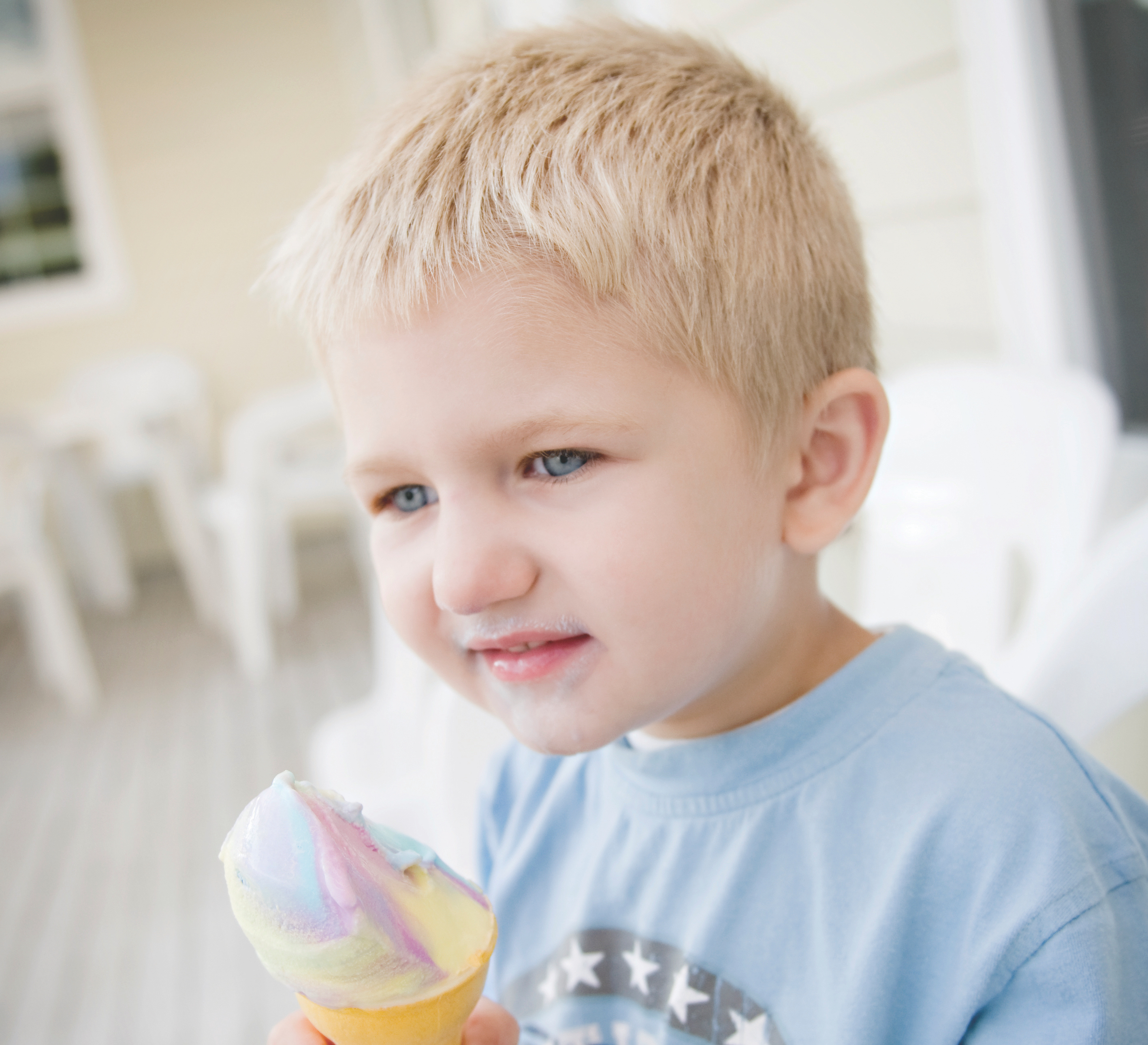 Little boy holding ice cream cone