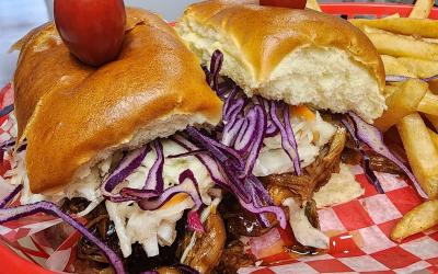 East Coast Smokehouse sandwich and fries on a plate.