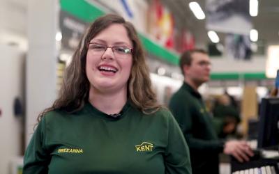 Kent employee smiling for photo in store.