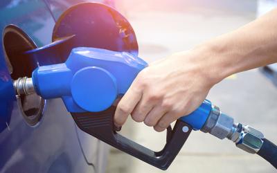 Person filling up on fuel at the pump.