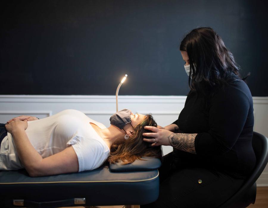 Woman receiving a head massage at spa